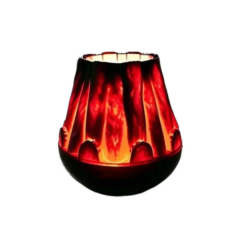 Flame effect Christmas projector lamp with an ember-red body on a white background