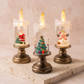 Three flameless LED candle night lights with Santa, Christmas tree and snowman scenes